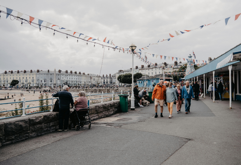 people walking on llandudno pier